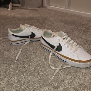 Nike White Sneakers with Black and Gold Details